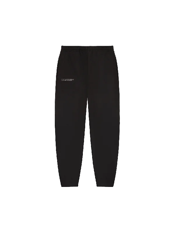 High - Waisted Women's Jogger Sweatpants in Black with Zip Pockets for a Stylish and Practical Look Womens DNA Barrel-Leg Track Pants—black High - Waisted Women's Jogger Sweatpants in Black with Zip Pockets for a Stylish and Practical Look Womens DNA Barrel-Leg Track Pants—black