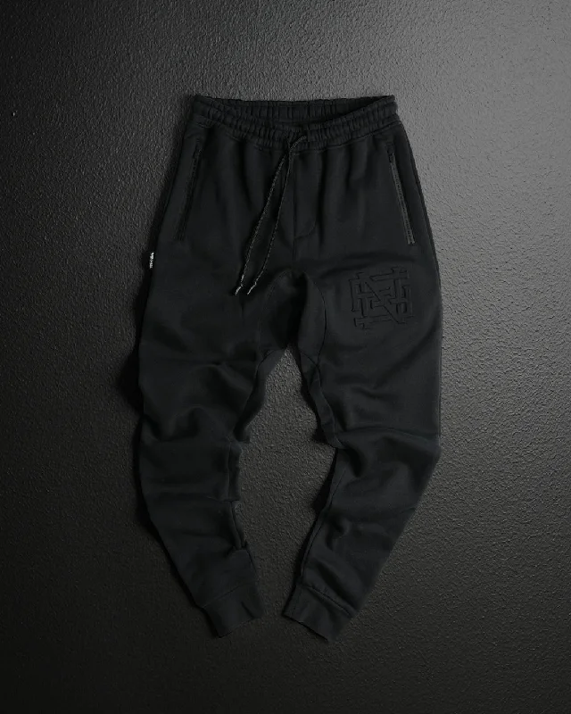 High - Waisted Women's Jogger Sweatpants in Black with Zip Pockets for a Stylish and Practical Look EMBOSSED FITTED JOGGERS-BLACK High - Waisted Women's Jogger Sweatpants in Black with Zip Pockets for a Stylish and Practical Look EMBOSSED FITTED JOGGERS-BLACK