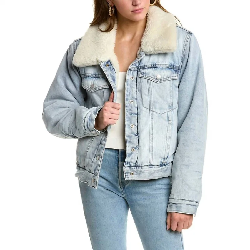 Denim Top with a Belted Waist for a Defined Silhouette Oversized Reversible Sherpa Denim Trucker Jacket In Light Denim Denim Top with a Belted Waist for a Defined Silhouette Oversized Reversible Sherpa Denim Trucker Jacket In Light Denim