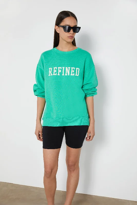 Women's hoodie with a kangaroo pocket and a pom - pom drawstring for added charm REFINED OVERSIZED SWEATSHIRT Women's hoodie with a kangaroo pocket and a pom - pom drawstring for added charm REFINED OVERSIZED SWEATSHIRT