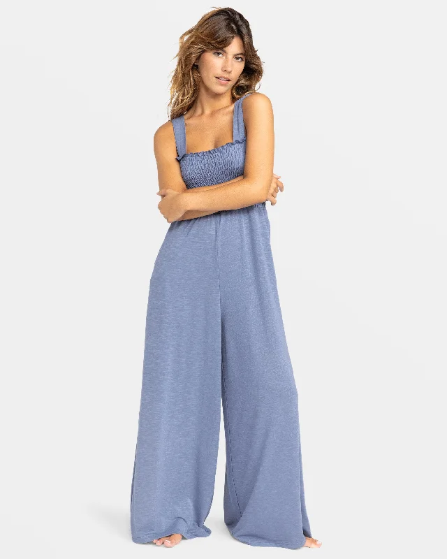 Denim women jumpsuits with ripped details for a casual - edgy look Just Passing By Smocked Jumpsuit - Wild Wind Denim women jumpsuits with ripped details for a casual - edgy look Just Passing By Smocked Jumpsuit - Wild Wind