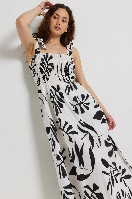 Backless Women Dress for a Sexy and Alluring Look at Evening Events Backless Women Dress for a Sexy and Alluring Look at Evening Events Capricorn Ivory Leaf Print Tie Strap Shirred Midi Dress